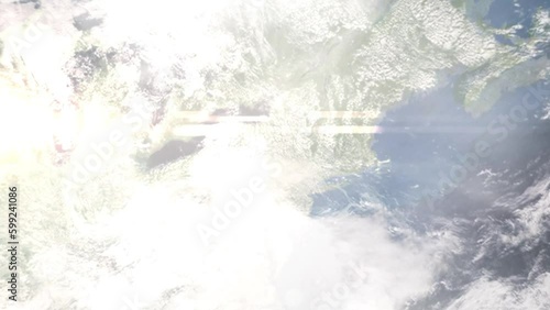 Earth zoom in from outer space to city. Zooming on Binghamton, New York, USA. The animation continues by zoom out through clouds and atmosphere into space. Images from NASA