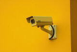 CCTV Modern Surveillance Camera on a yellow wall, AI Generated