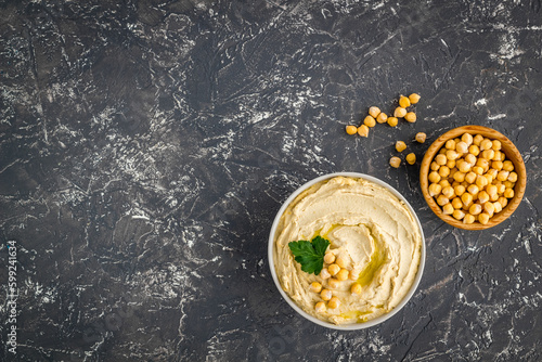 Dishes of chickpeas with tahini - homemade hummus in bowl