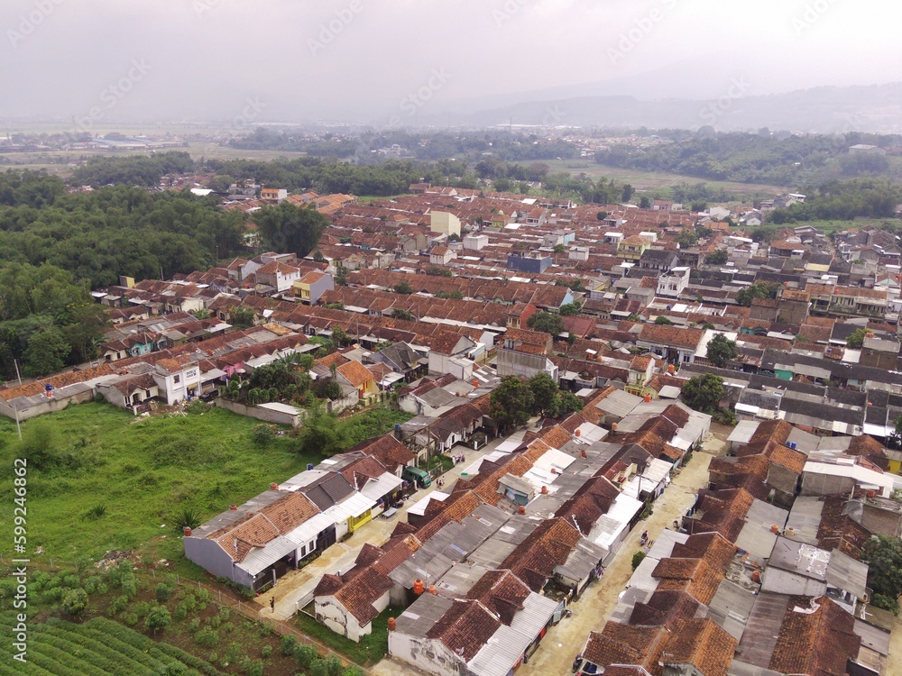 Fototapeta premium Aerial Photography. Bird's eye view of public housing in the valley of Mount Pangradinan. Location place in Cikancung, on the outskirts of Bandung Region - Indonesia