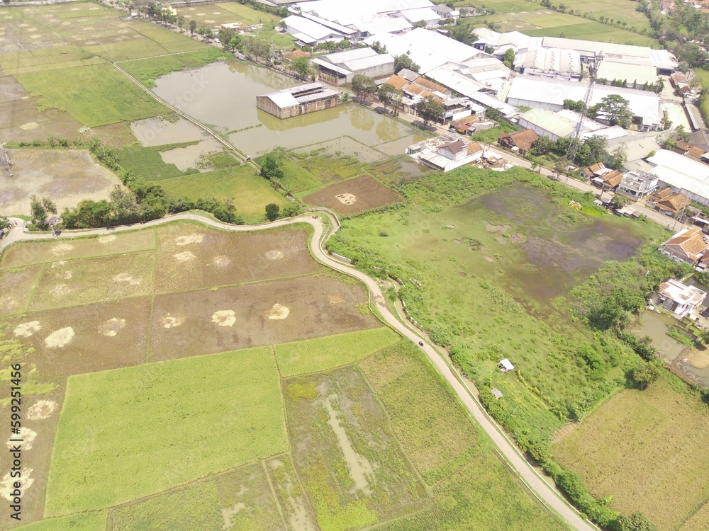 Aerial Photography. Bird's eye view from a drone flying over a winding road. Location place in Bandung Region - Indonesia Aerial Photography. Bird's eye view from a drone flying over a winding road. Location place in Bandung Region - Indonesia