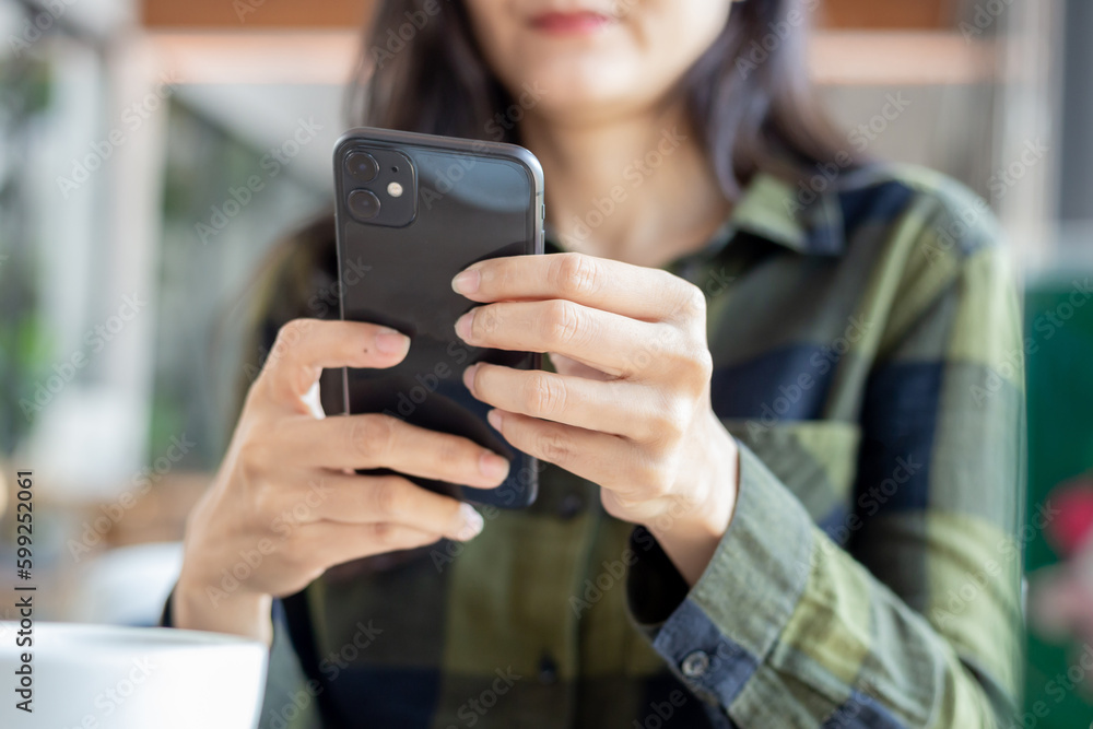 using cell phone hand holding mobile texting message contact us.chatting,search internet information.technology device communication connecting using cell phone hand holding mobile texting message contact us.chatting,search internet information.technology device communication connecting