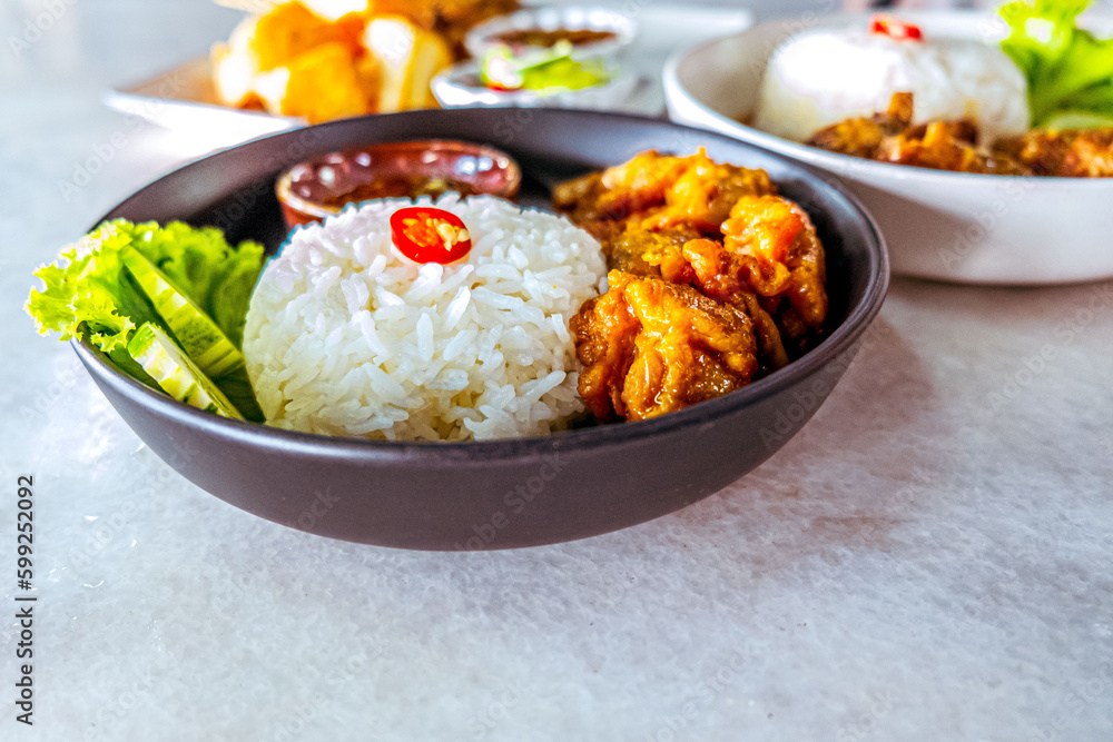 Thai Street Food Delight: Savory Fried Chicken with Fish Sauce and Rice Thai Street Food Delight: Savory Fried Chicken with Fish Sauce and Rice