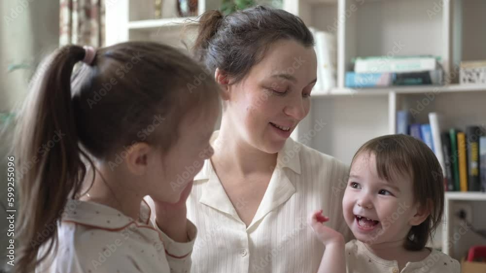 Mother Playing And Hugging With Two Little Daughters Mother Playing And Hugging With Two Little Daughters