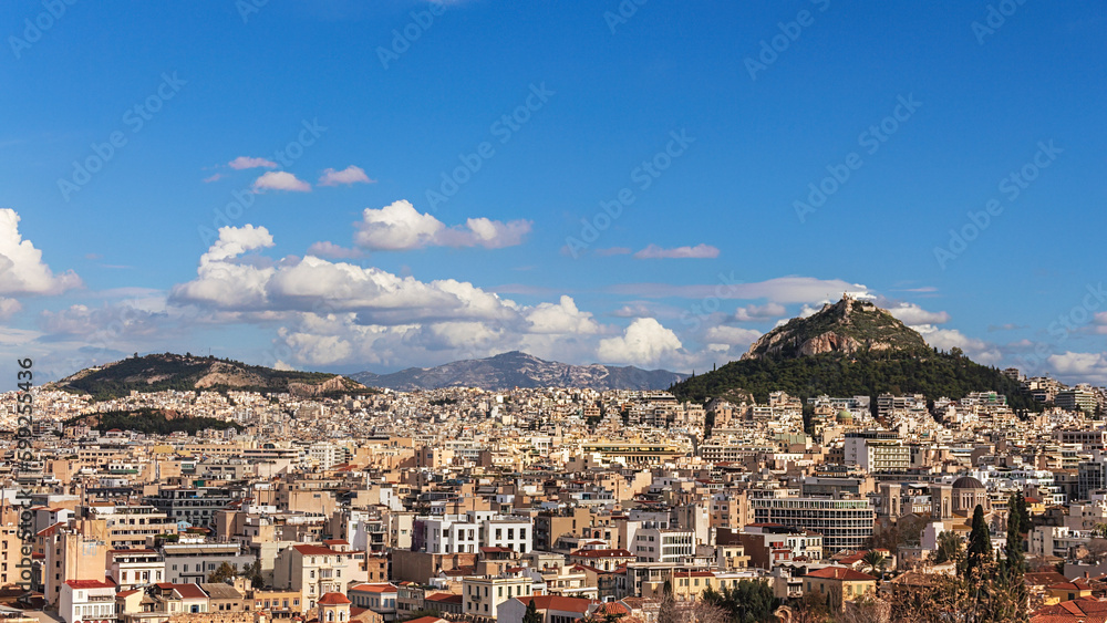 Panorama of Athens, view of Lycabettus mount from Acropolis foot, Greece. Skyline of Athens city center. Cityscape of historical town of Athens with old and modern Greek houses. Travel concept
