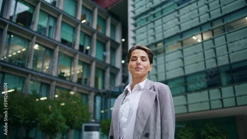 Wallpaper Mural Businesswoman posing office building in suit. Successful middle aged woman look Torontodigital.ca