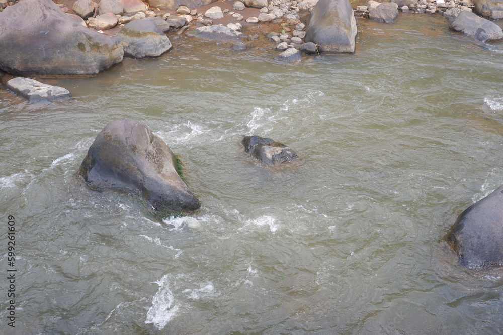Fototapeta premium Mountain river with clear water. The rapid flow of a mountain river