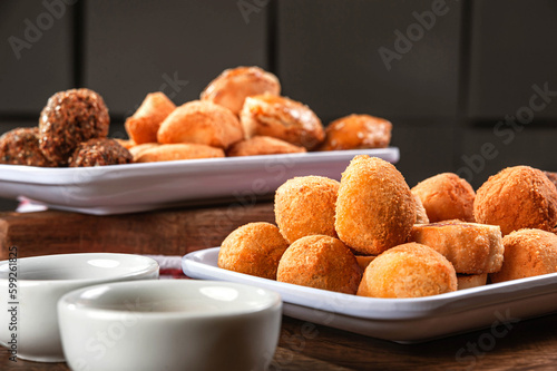 Various brazilian snacks deep fried. (Coxinha, kibe, empadinha e risolis). photo