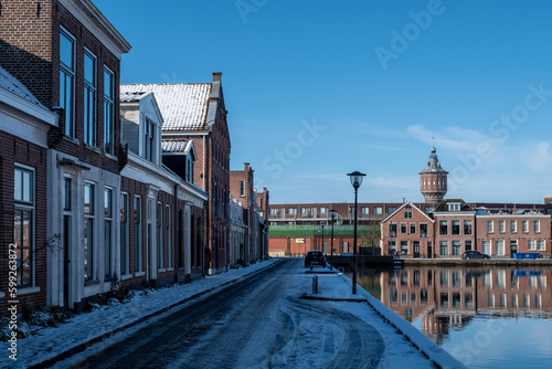 Water canal in the historic city of Sneek and winter