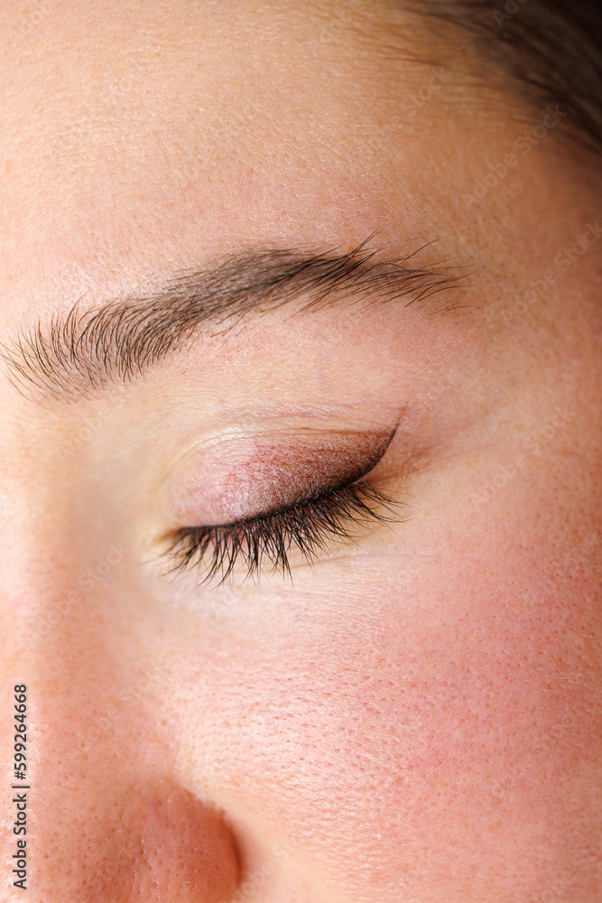 macro photo performing eyelid tattooing. Permanent make-up of the eyelids, eyelash tattooing.