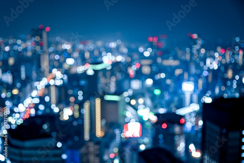 大都会の輝く夜景をぼかした背景素材