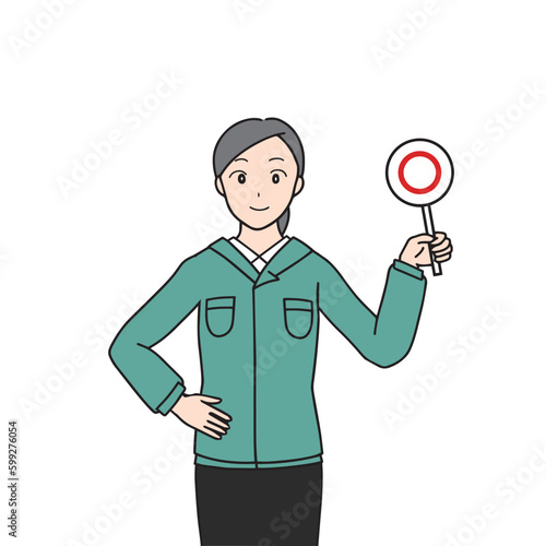 マルを示す女性作業員