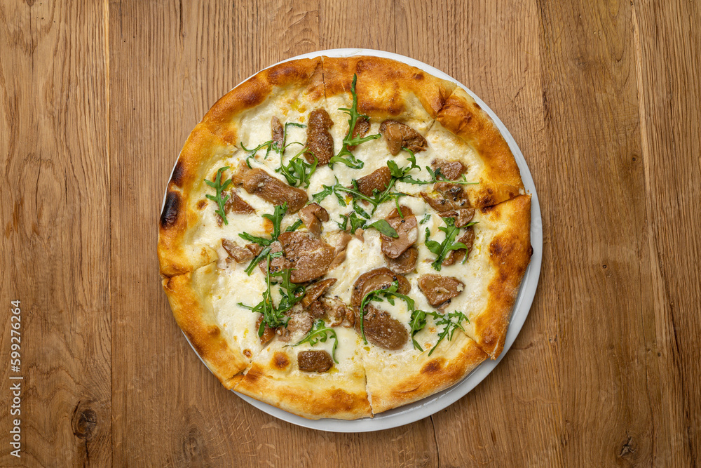 delicious italian pizza on a wooden table
delicious italian pizza on a wooden table