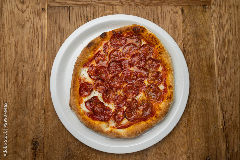 delicious italian pizza on a wooden table
delicious italian pizza on a wooden table