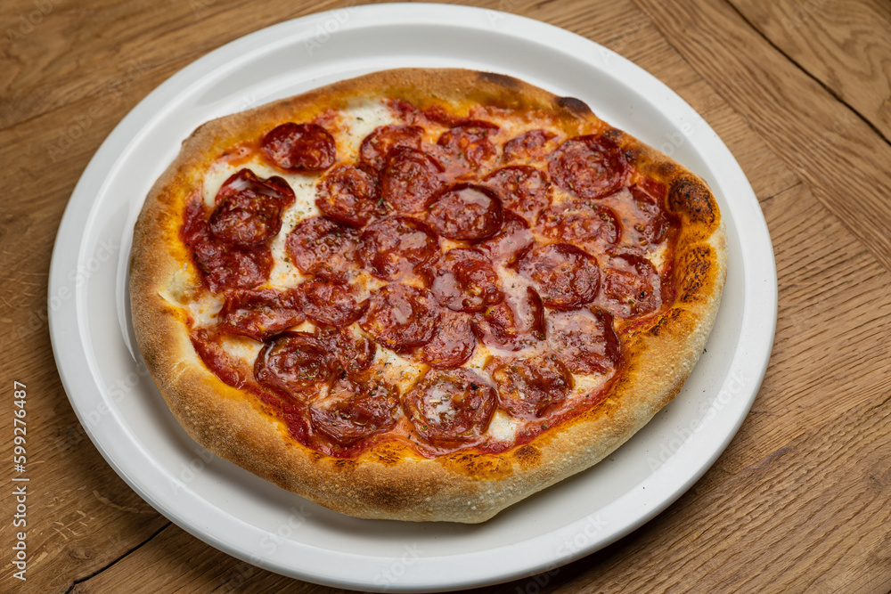 delicious italian pizza on a wooden table
delicious italian pizza on a wooden table