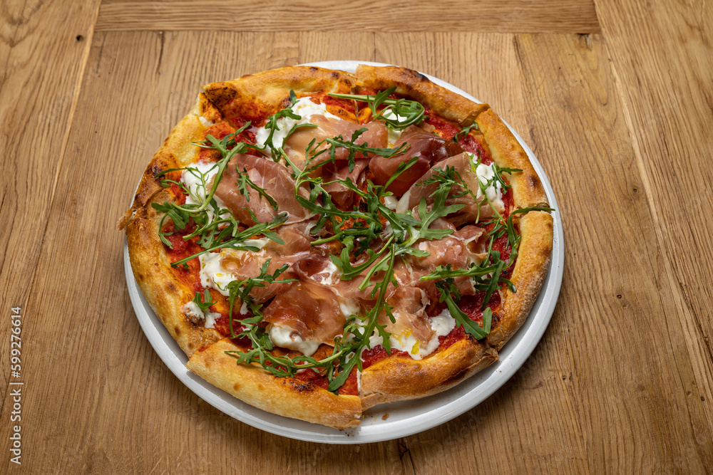 delicious italian pizza on a wooden table
delicious italian pizza on a wooden table