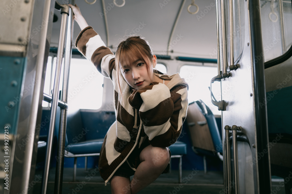 portrait of an asian girl on the bus Stock Photo | Adobe Stock