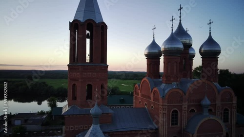 Kirovo - Chepetsk, Russia On June 23, 2022, a drone flight over the All-Holy Christian Church, aerial photography before sunset from a bird's-eye view. Sunset video photo