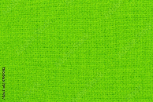 Light green lime cotton fabric cloth texture for background, natural textile pattern.
