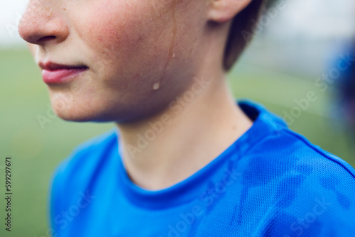 Close-up of boy (12-13) sweating photo