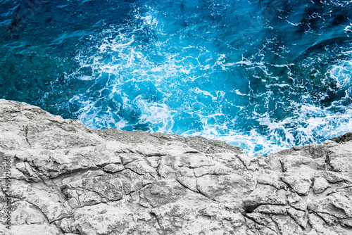 Fotografie Beautiful blue mediterranean sea with rocks in Blue Grotto, Malta, stock photo