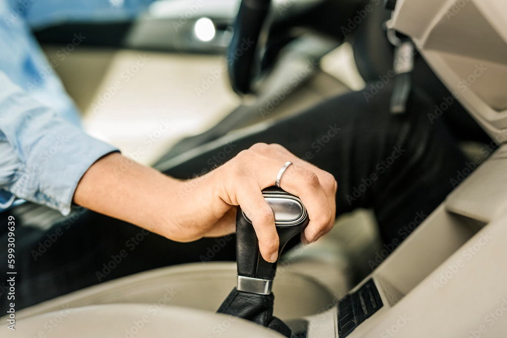 Mid section of woman driving car Mid section of woman driving car