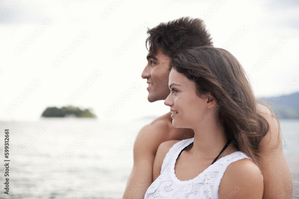 Nurturing their love in nature. an intimate young couple enjoying a vacation by the sea. Nurturing their love in nature. an intimate young couple enjoying a vacation by the sea.