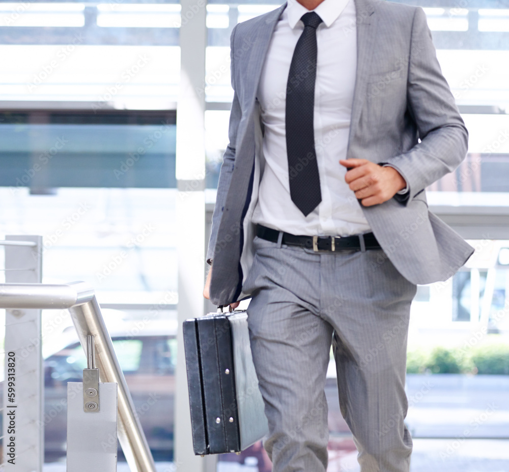 Late for a meeting...Closeup cropped image of a businessman with a briefcase going somewhere in a hurry. Late for a meeting...Closeup cropped image of a businessman with a briefcase going somewhere in a hurry.