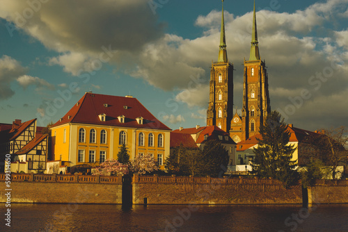 Poland, Wroclaw, April 16, 2022. View to Odra River and Tumski Island. Old Town of Wroclaw in Spring  photo