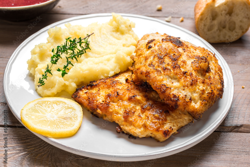 Schnitzel or breaded chop with mashed potatoes Schnitzel or breaded chop with mashed potatoes