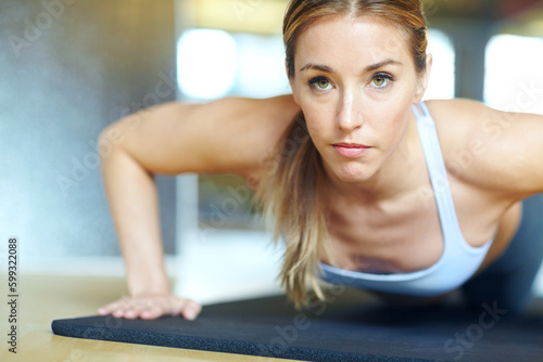 Im making great progress. A beautiful young woman working out at the gym.