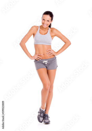 Exercise keeps me fit and feeling great. Portrait of an attractive and sporty young woman against a white background.