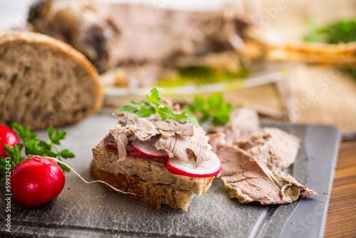 sandwich with baked meat, radish and herbs