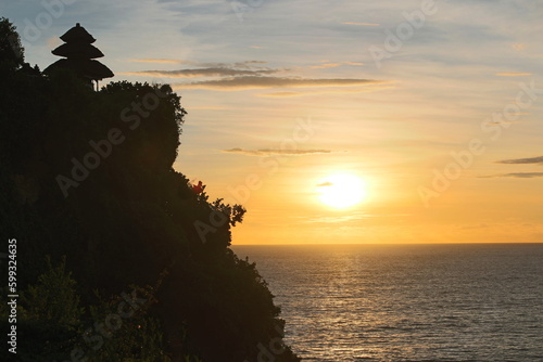 Sunset from the Ulu Watu temple in Bali over the Indian Ocean photo