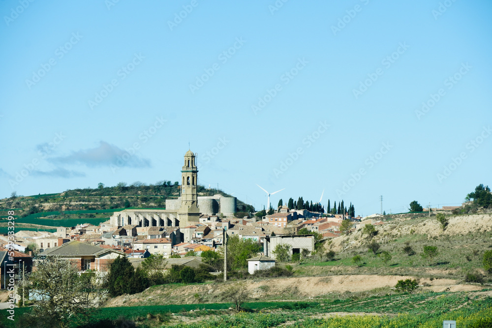 View of a village with the parish church of Sant Jaume de Calaf in the background. Villages of Catalonia. Village located in the region of Noya, Alta Segarra.