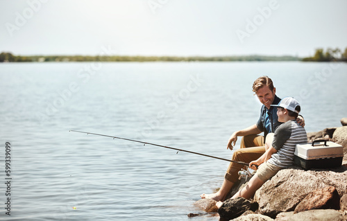 I think well reel some big ones in today. a father and his little son fishing together.