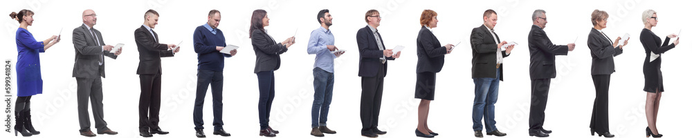 group of people holding tablet and looking ahead