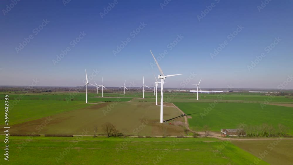 Wind farm with blue skies and green countryside Wind farm with blue skies and green countryside