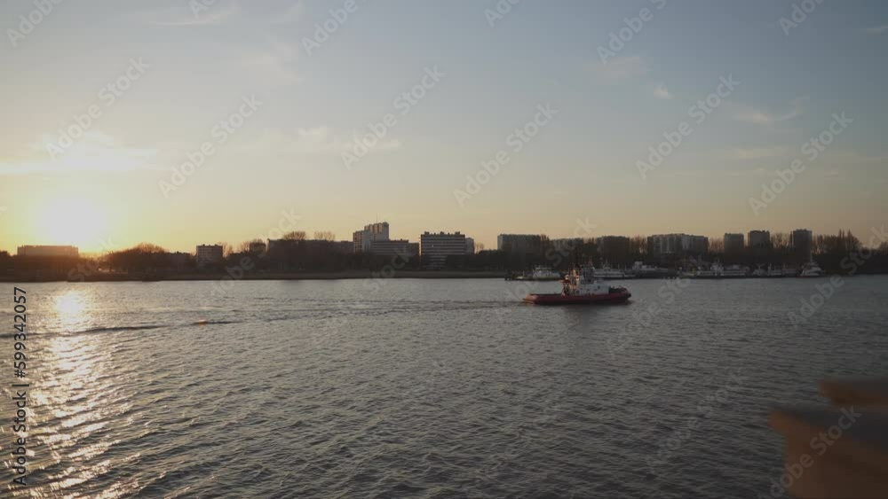 A tugboat glides along the Scheldt river in Antwerp Belgium A tugboat glides along the Scheldt river in Antwerp Belgium