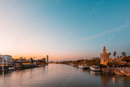 Seville s Iconic Landmarks at Blue Hour  Guadalquivir River  Triana District and Giralda Tower