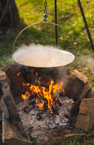 Delicious meal (goulash) made on traditional way in fish pot on camp fire