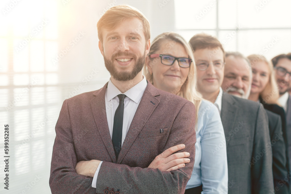 close up. smiling business people standing in one after another. close up. smiling business people standing in one after another.
