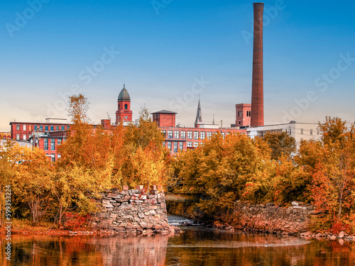 Old factory city in Autumn. Lewiston, Maine clear sky. Landscape background photography photo