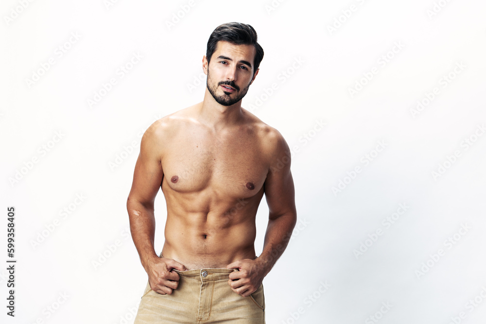 Fototapeta premium Male athlete model with naked torso and packs of abs sporty on white isolated background, trendy clothing style, copy space, space for text