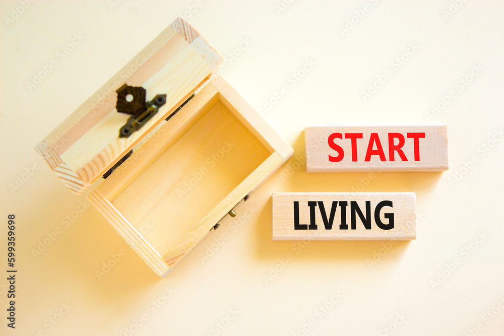 Start living symbol. Concept words Start living on beautiful wooden block. Beautiful white table white background. Empty wooden chest. Business and Start living concept. Copy space. Start living symbol. Concept words Start living on beautiful wooden block. Beautiful white table white background. Empty wooden chest. Business and Start living concept. Copy space.