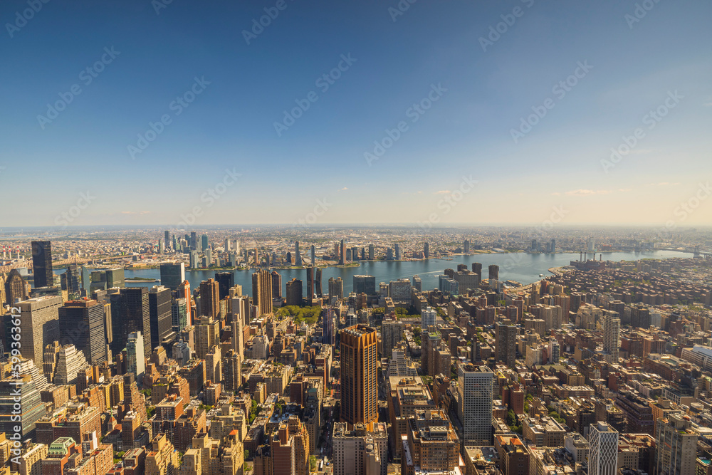 Panoramic view till down with of Empire State Building on skyscrapers buildings Manhattan. New York, USA. - obrazy, fototapety, plakaty 