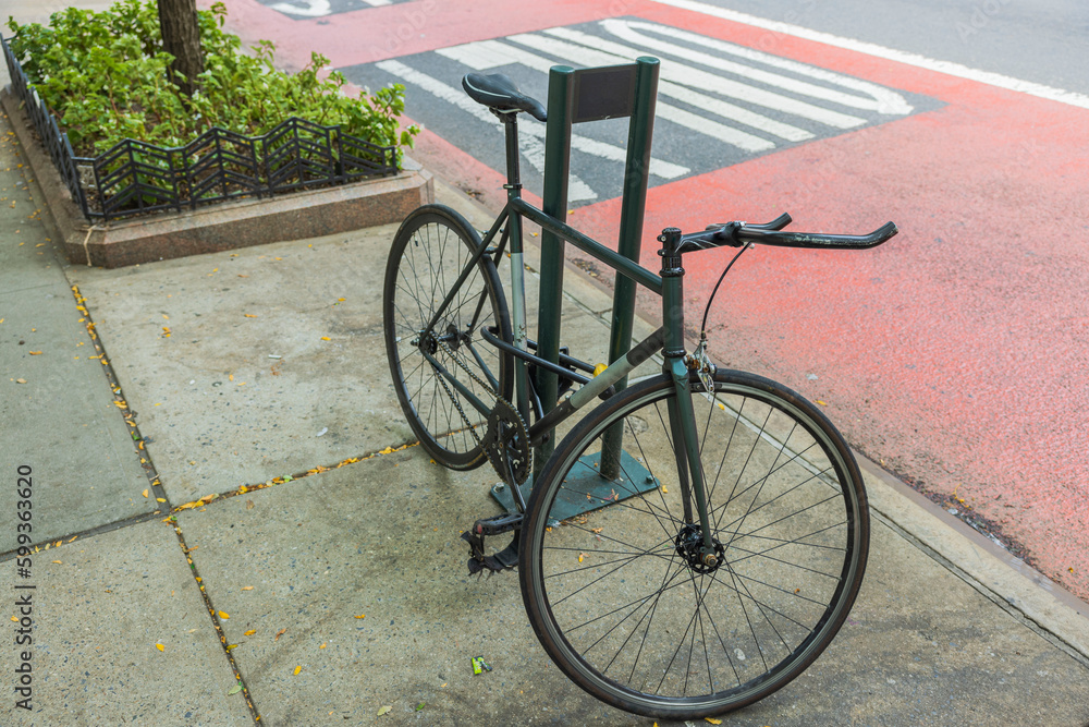 View of parked bicycle in parking lot on New York street in Manhattan. New York. USA. 