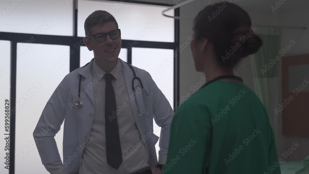 the male doctor and the female doctor discuss with the elderly patient after operation the male doctor and the female doctor discuss with the elderly patient after operation