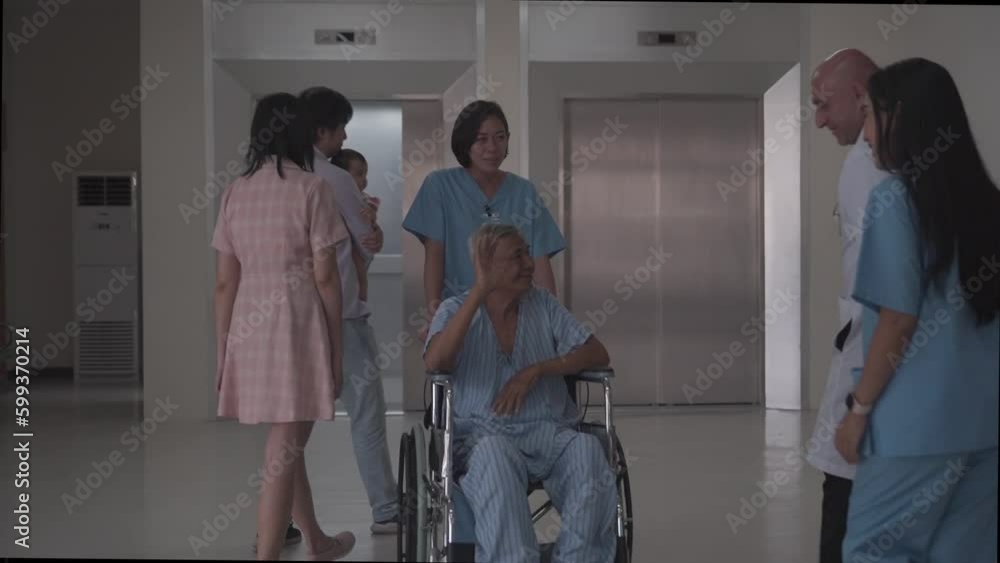 male doctor having discussion with the elderly patient on the wheel chair about his condition after operation in the hospital. male doctor having discussion with the elderly patient on the wheel chair about his condition after operation in the hospital.
