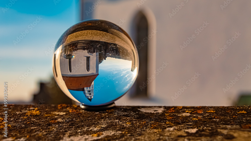 Crystal ball summer landscape shot with a church at Arnstorf, Rottal-Inn, Bavaria, Germany Crystal ball summer landscape shot with a church at Arnstorf, Rottal-Inn, Bavaria, Germany